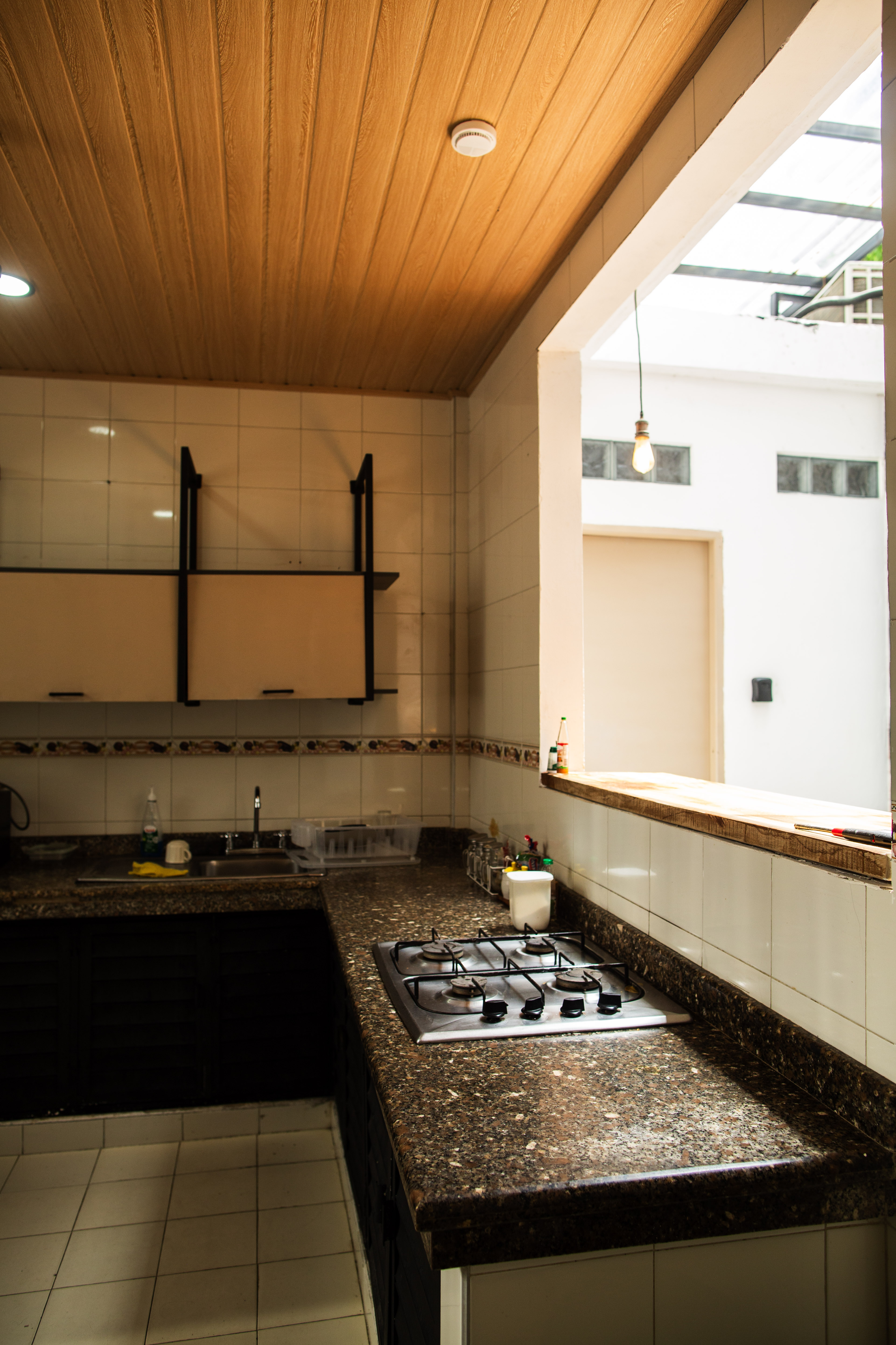 Cocina común equipada para huéspedes de Casa Santa Cruz